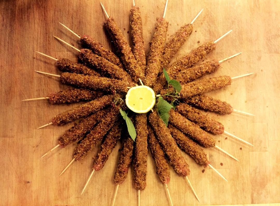 Breaded skewers arranged on a wooden board
