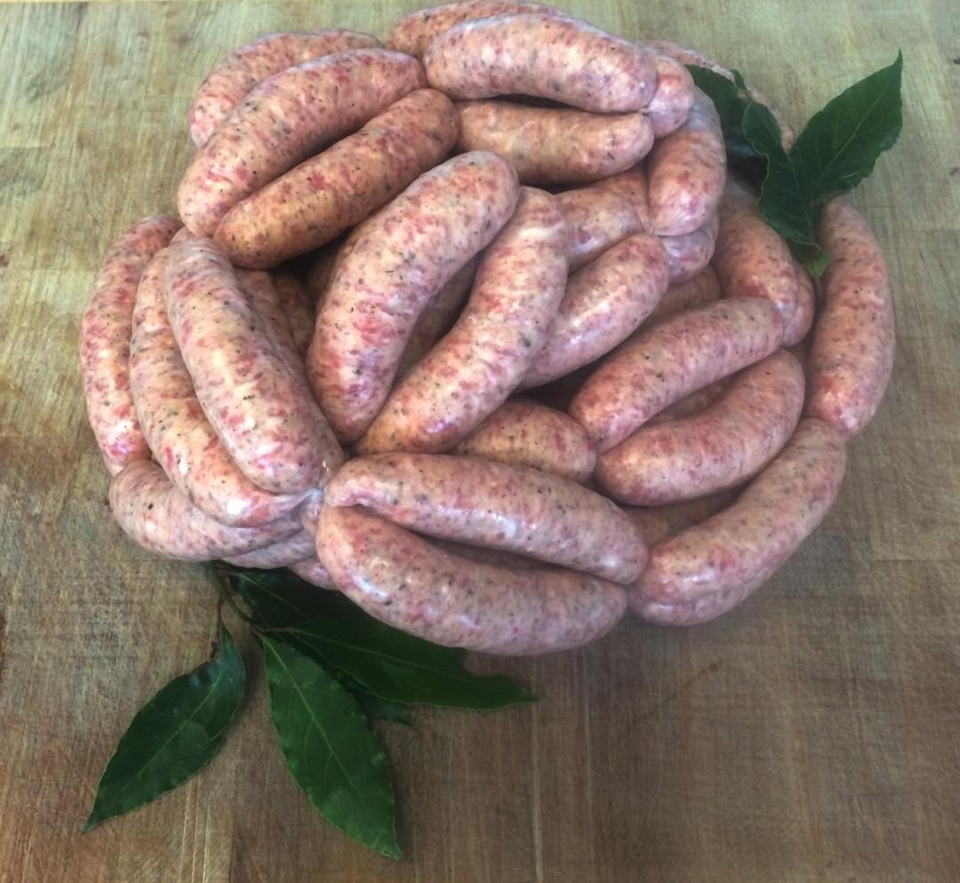 Colemans coiled sausage on a butcher block